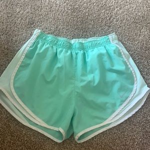 Green Nike running shorts